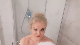 A Mature Blonde With Large Breasts Enjoys A Sensual Shower